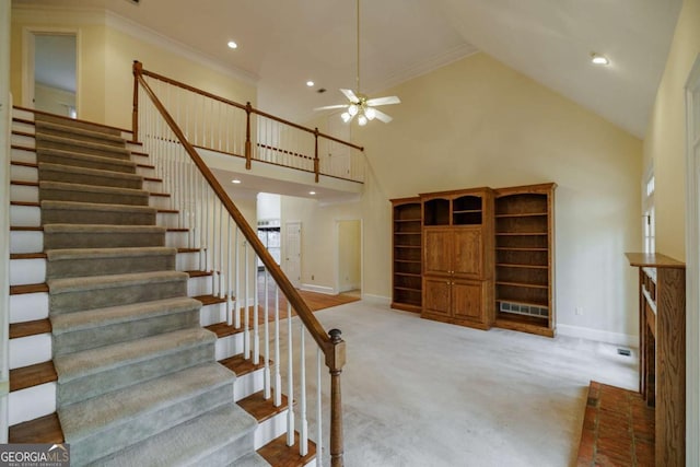 staircase featuring ornamental molding, recessed lighting, a high ceiling, carpet, and baseboards