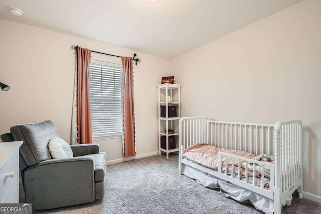 carpeted bedroom with baseboards