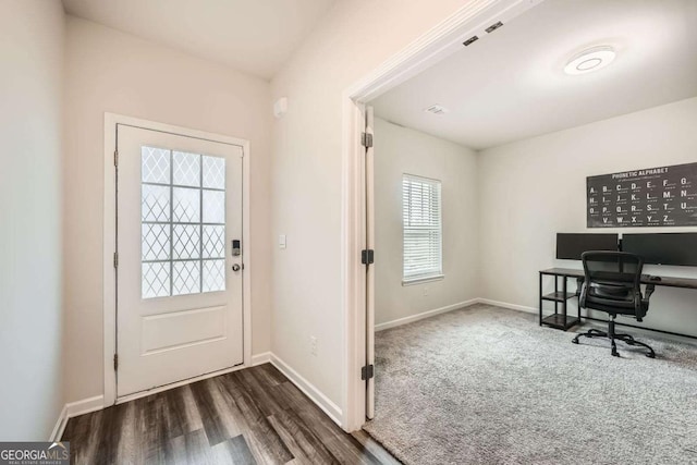 interior space featuring dark wood-style floors and baseboards