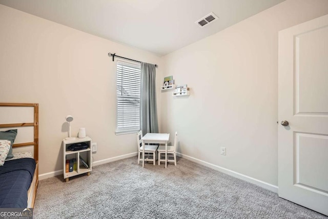 interior space with visible vents, carpet floors, and baseboards