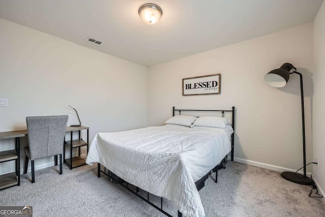 bedroom featuring visible vents, baseboards, and carpet flooring