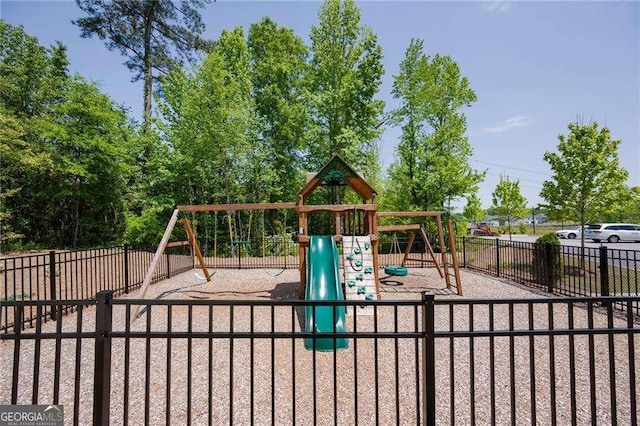 communal playground featuring fence