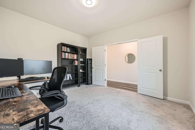 carpeted office with baseboards