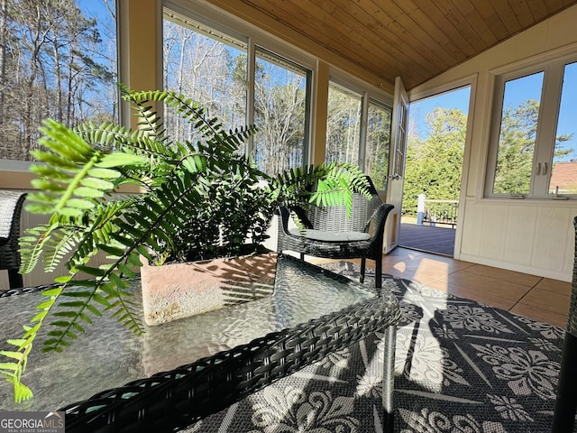 sunroom / solarium with wood ceiling and vaulted ceiling