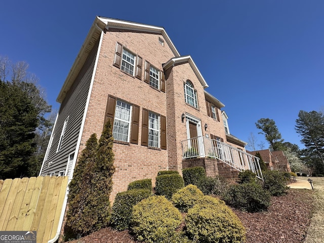 view of home's exterior featuring brick siding