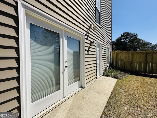 doorway to property with fence