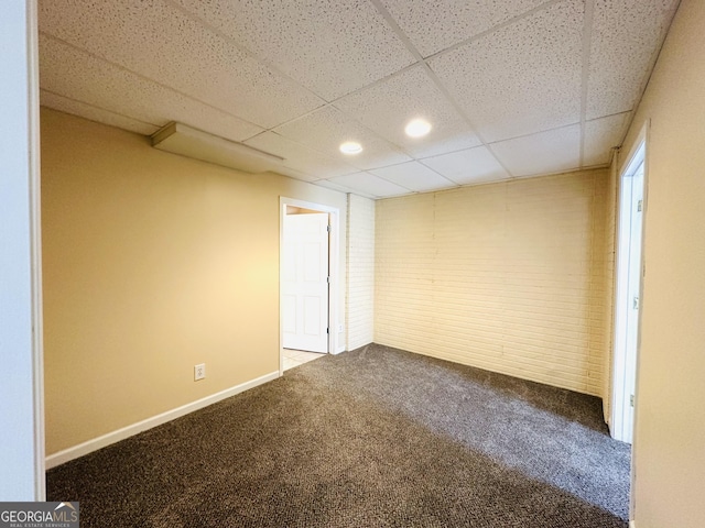 interior space with recessed lighting, a paneled ceiling, carpet floors, and baseboards