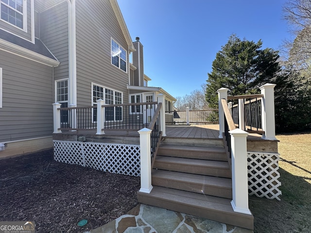 wooden terrace featuring stairs