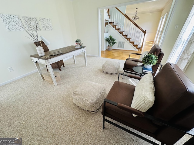 home office with carpet flooring, a notable chandelier, baseboards, and visible vents