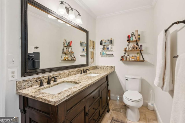 bathroom featuring a sink, toilet, ornamental molding, and double vanity