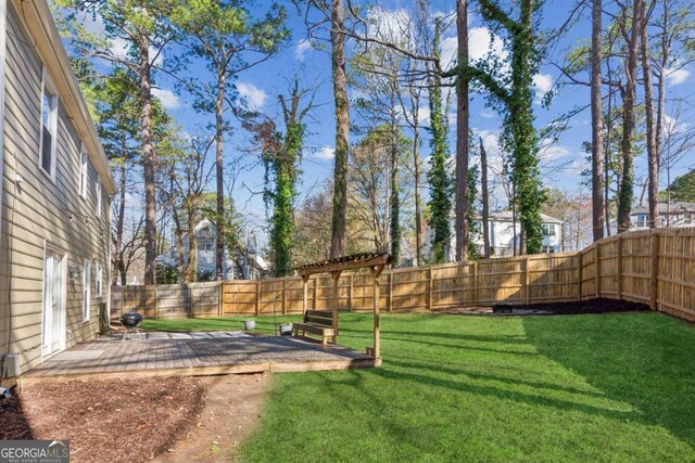 view of yard featuring a patio area and a fenced backyard