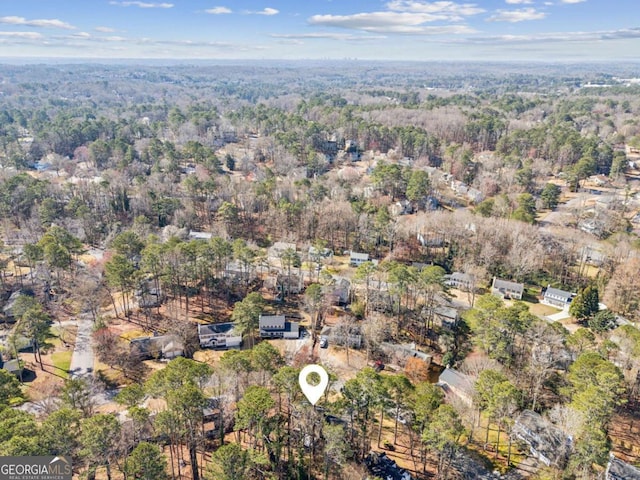 drone / aerial view featuring a view of trees