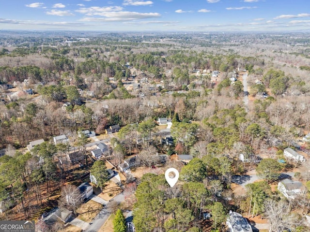 aerial view featuring a wooded view