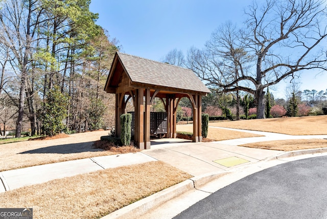 view of home's community featuring mail area