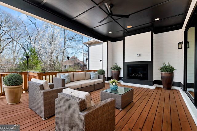 wooden deck with outdoor lounge area