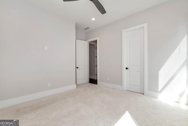 unfurnished bedroom featuring visible vents, baseboards, light carpet, recessed lighting, and a ceiling fan