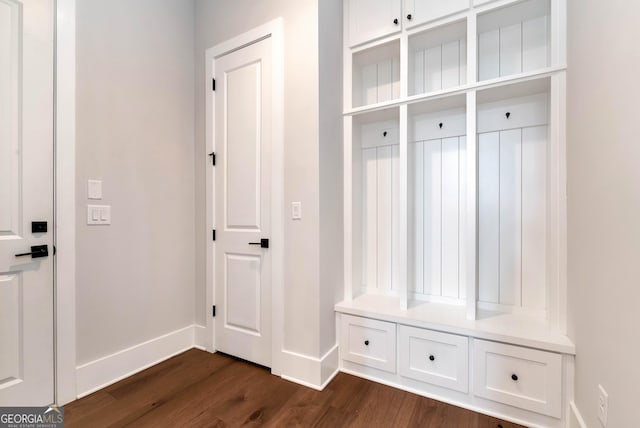 mudroom with baseboards and dark wood-style flooring