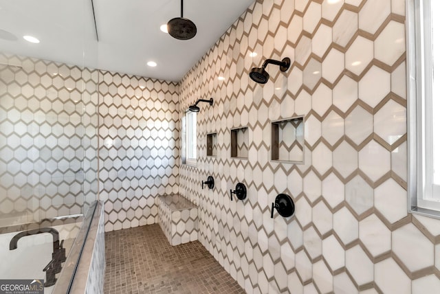 bathroom featuring recessed lighting and a tile shower