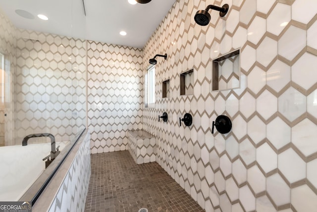 full bathroom with recessed lighting and tiled shower