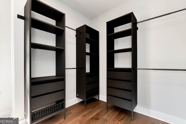 spacious closet with wood finished floors