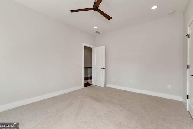 spare room with visible vents, recessed lighting, baseboards, and carpet floors