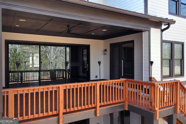 wooden deck with ceiling fan