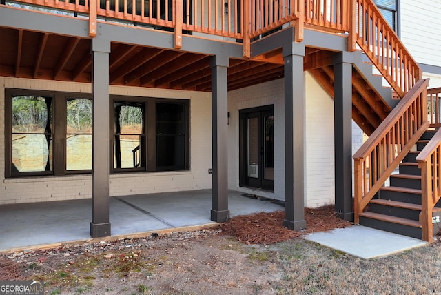 exterior space with stairway and a deck