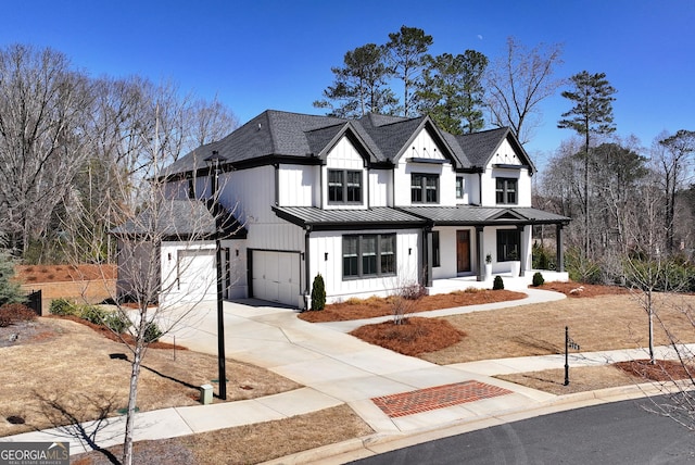 modern farmhouse with board and batten siding, metal roof, a porch, a garage, and a standing seam roof