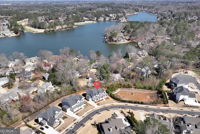 aerial view featuring a residential view and a water view