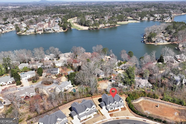 birds eye view of property featuring a residential view and a water view