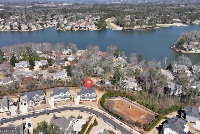 bird's eye view featuring a residential view and a water view