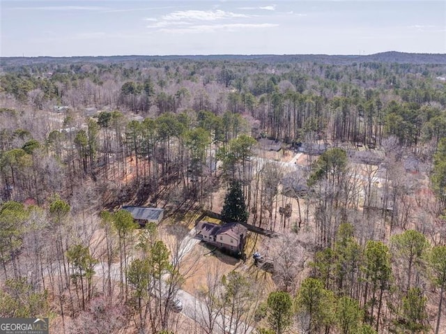 bird's eye view featuring a forest view