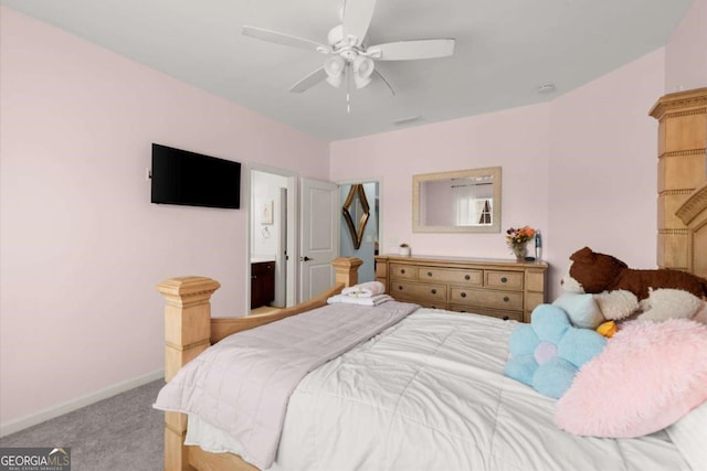 carpeted bedroom with ceiling fan and baseboards