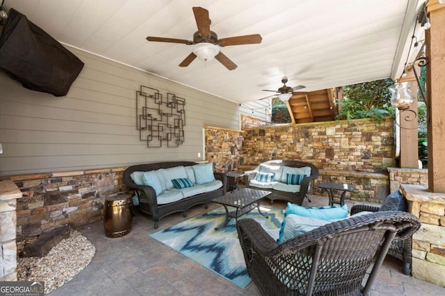 view of patio / terrace with an outdoor living space and a ceiling fan