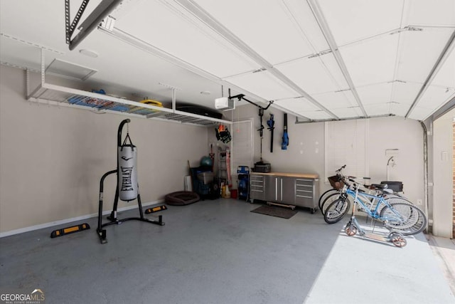 garage featuring baseboards and a garage door opener