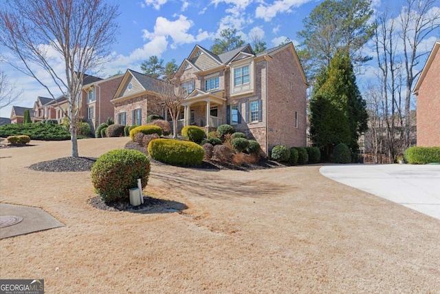 view of front of house with brick siding