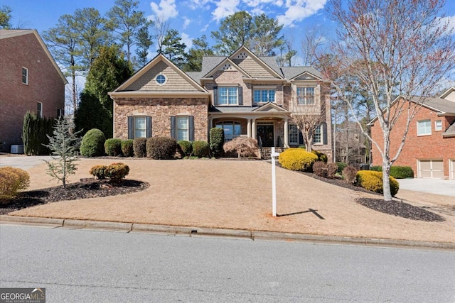 craftsman-style home with stone siding