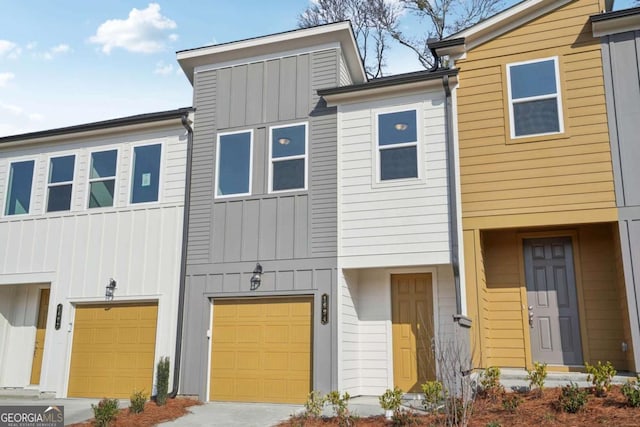 view of property featuring a garage and board and batten siding