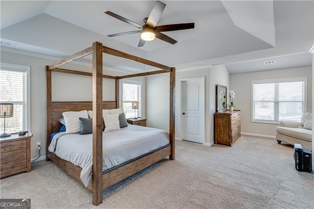 bedroom featuring visible vents, baseboards, light colored carpet, and a ceiling fan