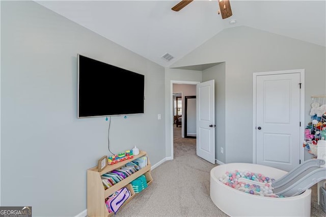 recreation room with a ceiling fan, baseboards, visible vents, carpet floors, and lofted ceiling