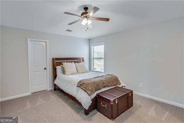 bedroom featuring visible vents, baseboards, and light colored carpet