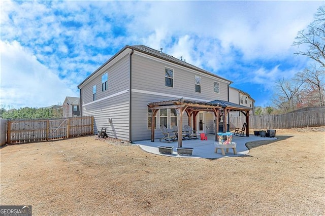 rear view of property with a patio area, a pergola, and a fenced backyard