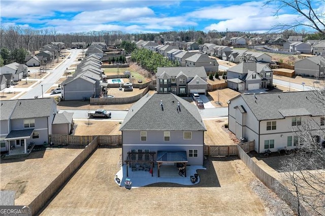 birds eye view of property with a residential view