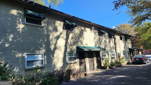 view of home's exterior with brick siding