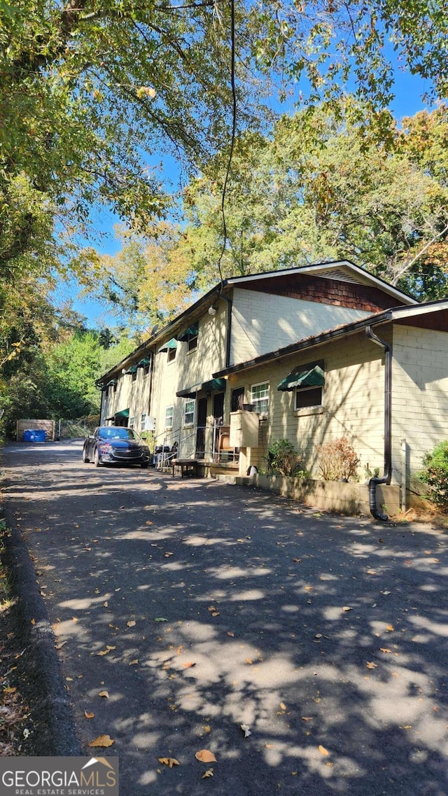 view of side of property featuring concrete block siding