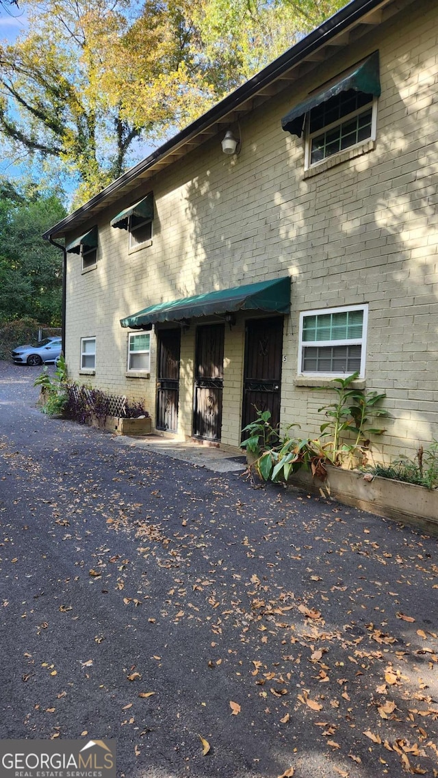 view of front of home featuring brick siding