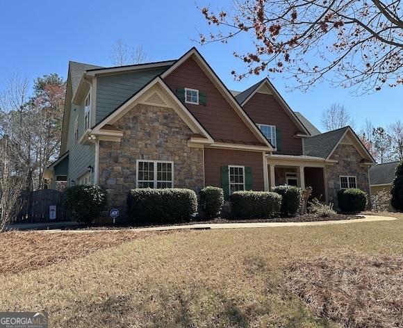 craftsman house with stone siding