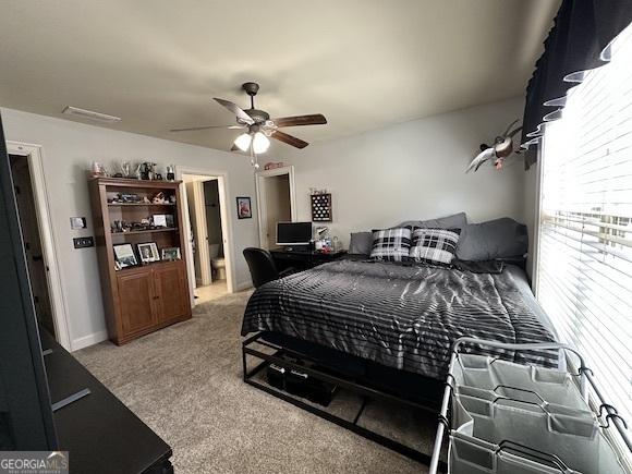 carpeted bedroom featuring a ceiling fan