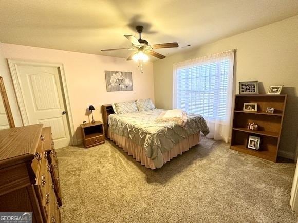 bedroom featuring ceiling fan and carpet flooring