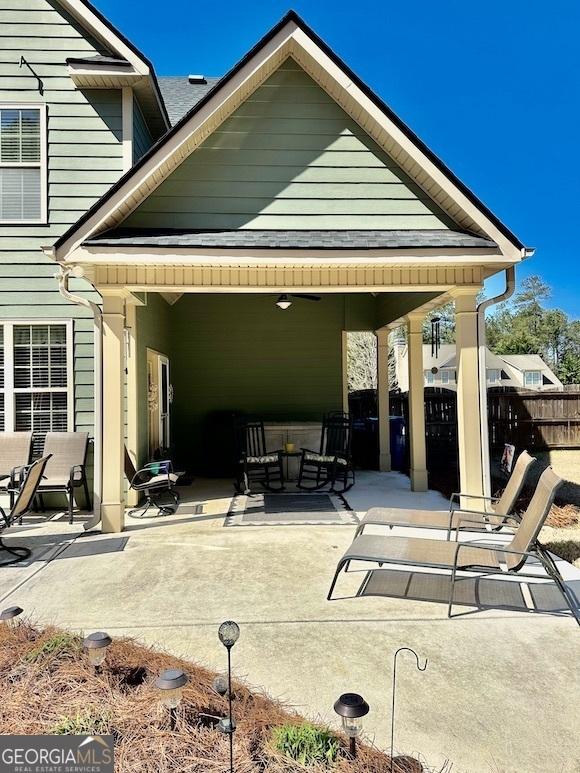 view of patio featuring fence